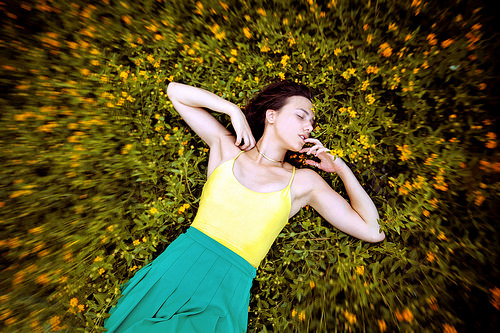 Women laying in flowers