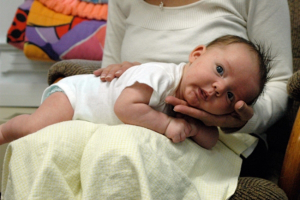 Burping baby lying down