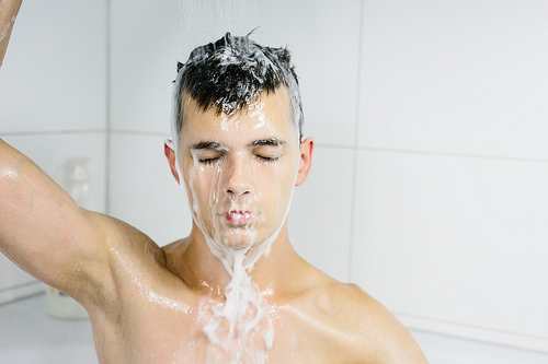 guy washing hair